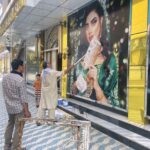 Afghan Taliban paint off images of women at beauty salons