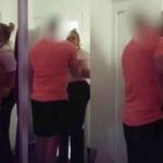 Female prison warder filmed kissing an inmate in his cell.