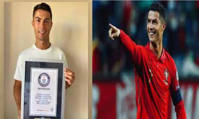 Cristiano Ronaldo poses with his Guinness World Record certificate for Most Goals in International Football