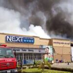 Goods worth millions retrieved by kind locals who intervened as Next Cash and Carry was razed by fire.