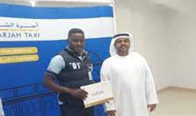 Nigerian man honored in UAE for returning about N12million forgotten in his cab