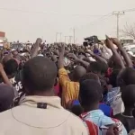 VIDEO: Roads Blocked As Dozens of Nigerians protest High Living Cost, hardship under Tinubu