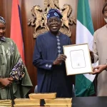 Dele Alake Presents Gold Bars To Tinubu