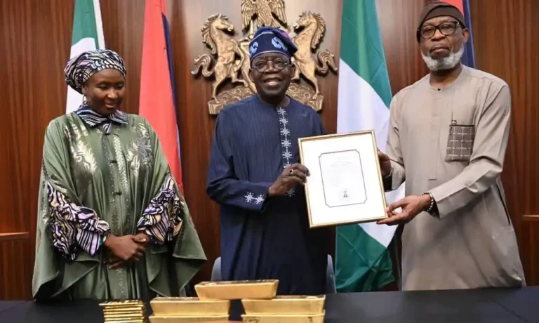 Dele Alake Presents Gold Bars To Tinubu