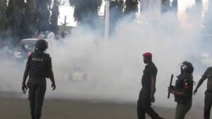 BREAKING: Tear gas fired as El-Rufai supporters, protesters clash at EFCC Headquarters